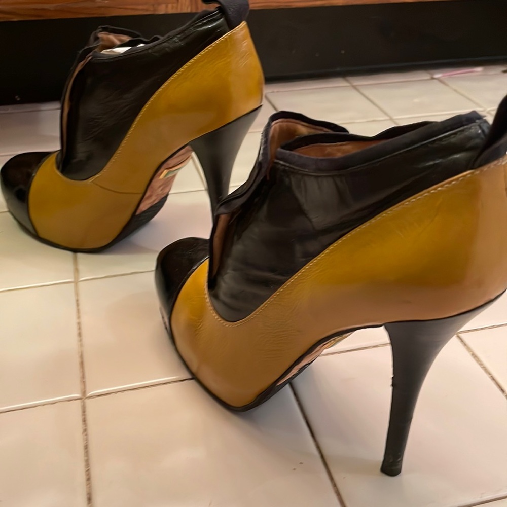 L.A.M.B booties, mustard-ish color and black